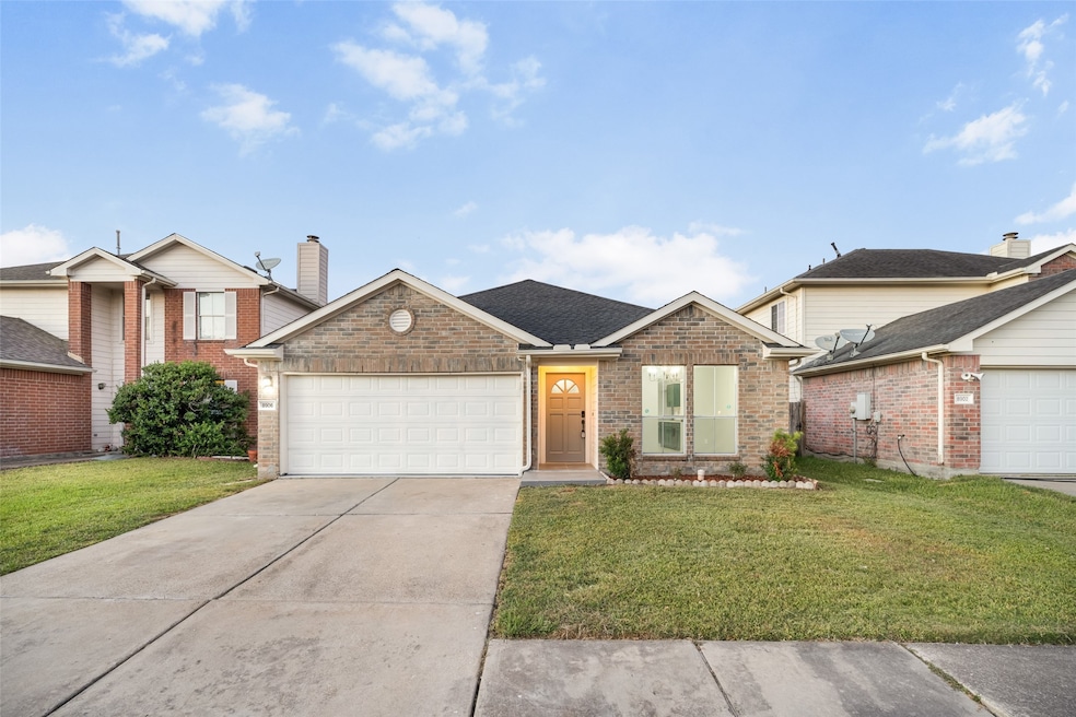 Charming single-story brick home with a welcoming front entry and attached garage. The well-maintained lawn and clean driveway enhance curb appeal, making it an inviting choice for buyers.