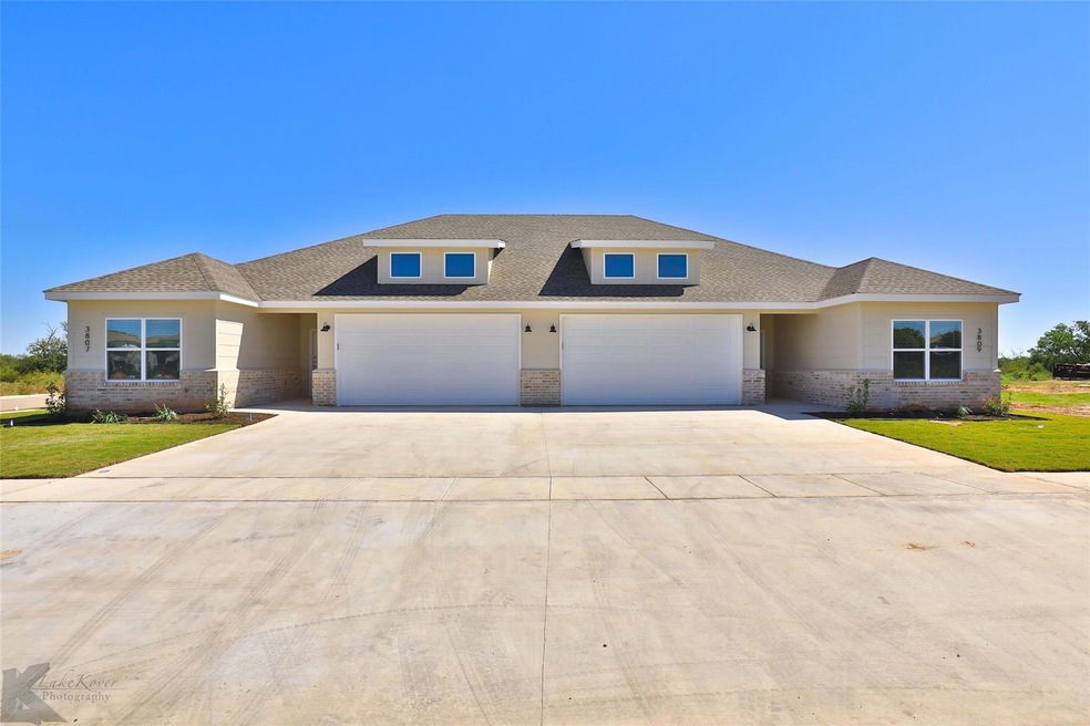 Prairie-style home featuring a garage