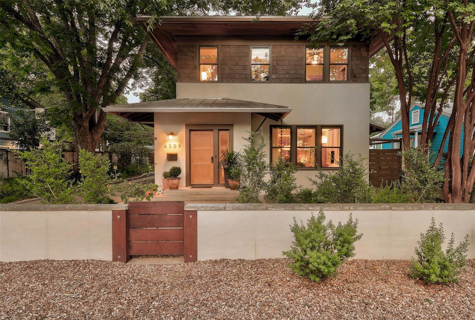 View of front facade with a fenced front yard and
