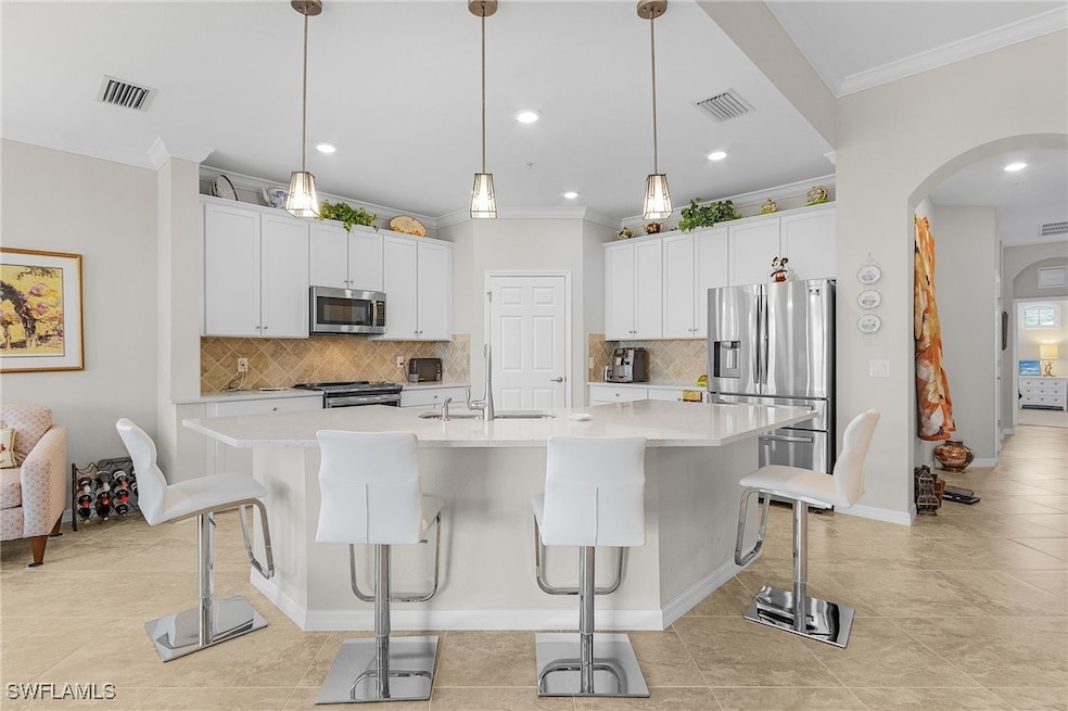 Kitchen featuring appliances with stainless steel