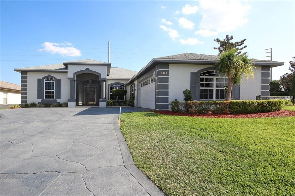 Front elevation with beautifully maintained landsc