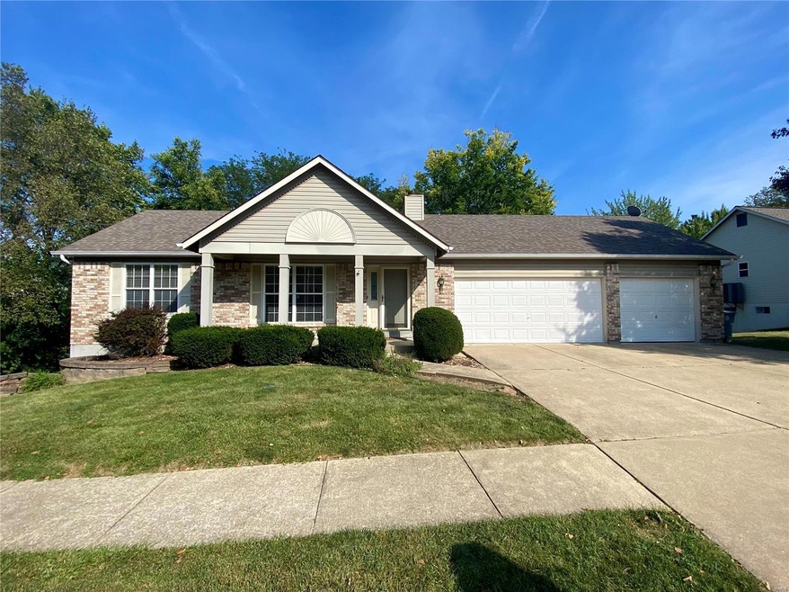 Front of home with 3-car garage and sidewalks. thr