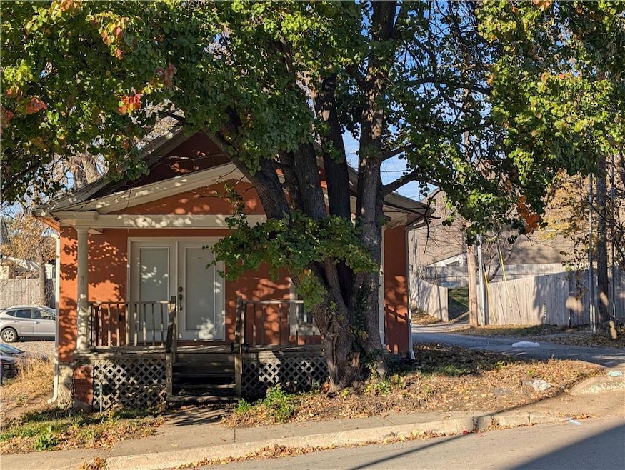 View of front facade featuring french doors and covered porch