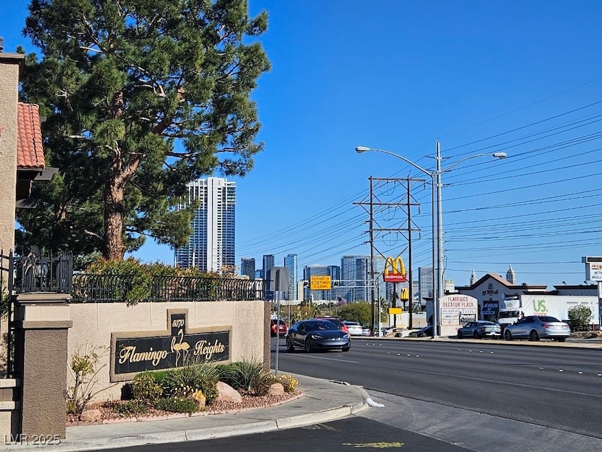 View of road with traffic lights, a city view, str