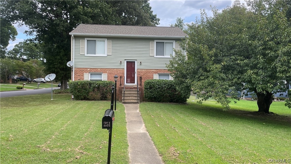 Split foyer home with a front lawn