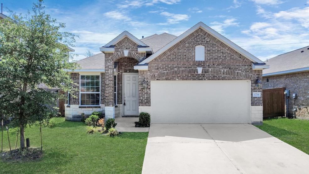 Charming single-story brick home with a two-car ga