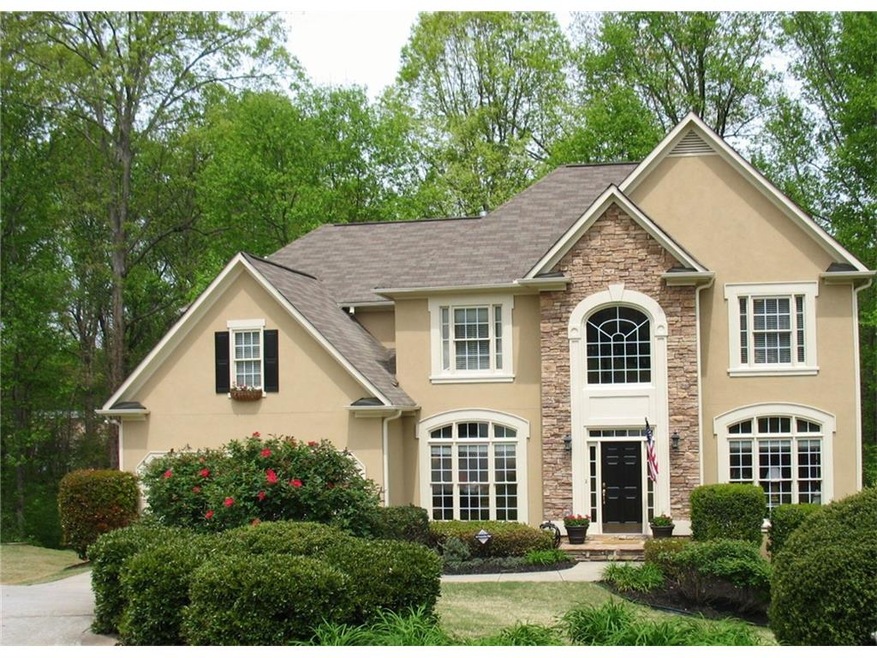 Gorgeous hardcoat stucco & stone front with 3 side