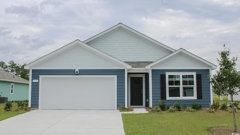 View of front of house with an attached garage, co