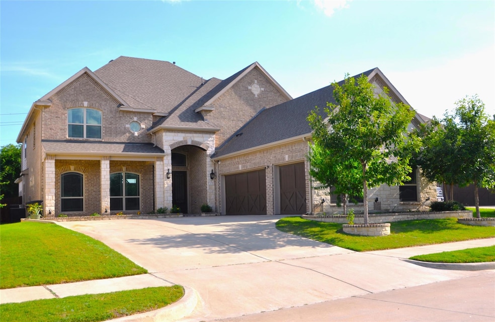 View of front of property featuring stone flowerbe