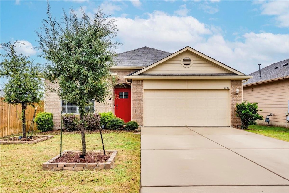 Single story home featuring brick siding, drivewa