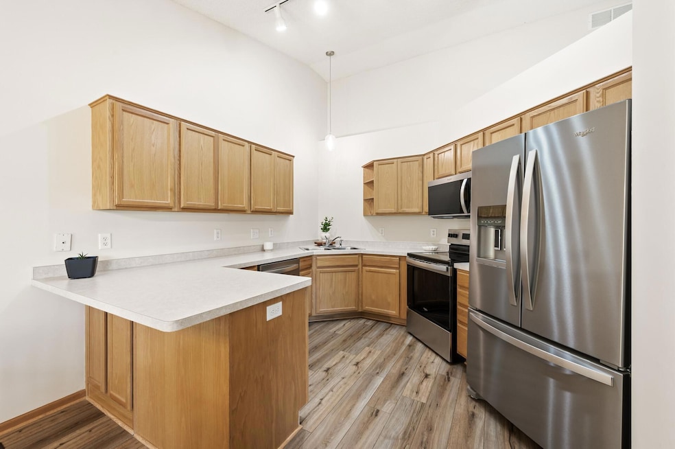 Welcome to 13408 Ximines Lane N Champlin!  Brand new stainless steel appliances, vaulted ceiling, and updated flooring!