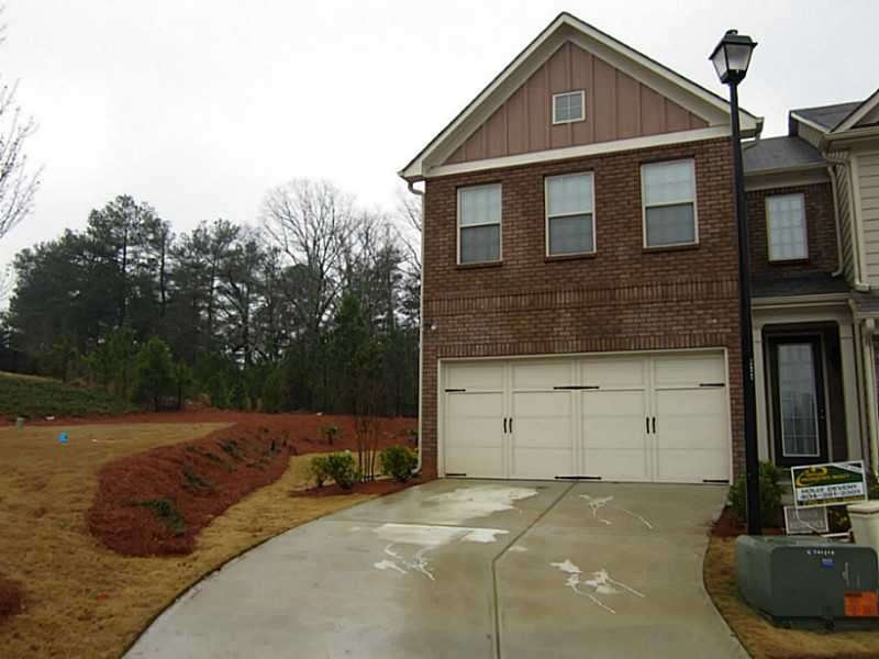 Exterior Front. End Unit with side yard!
