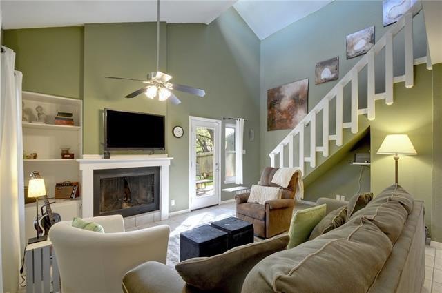 The beautiful living room features a fireplace a, 