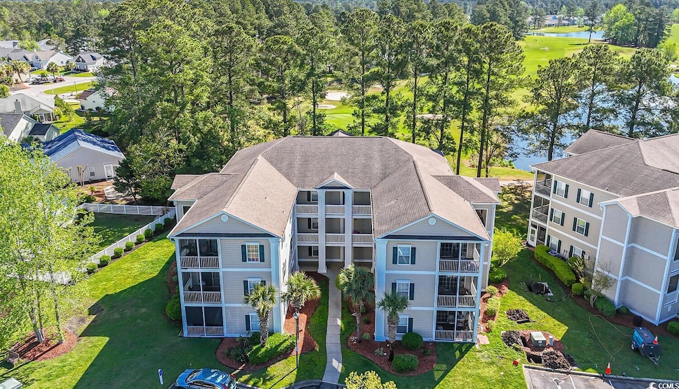 Aerial view featuring a water view and a residenti