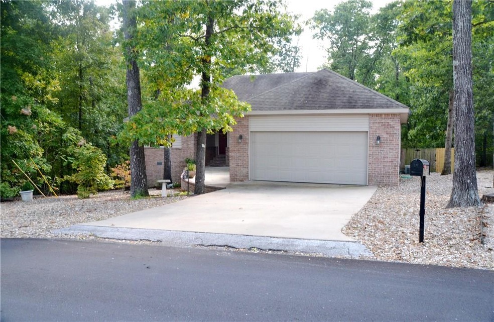 Level driveway leading to your new home. Beautiful maintenance free front yard.