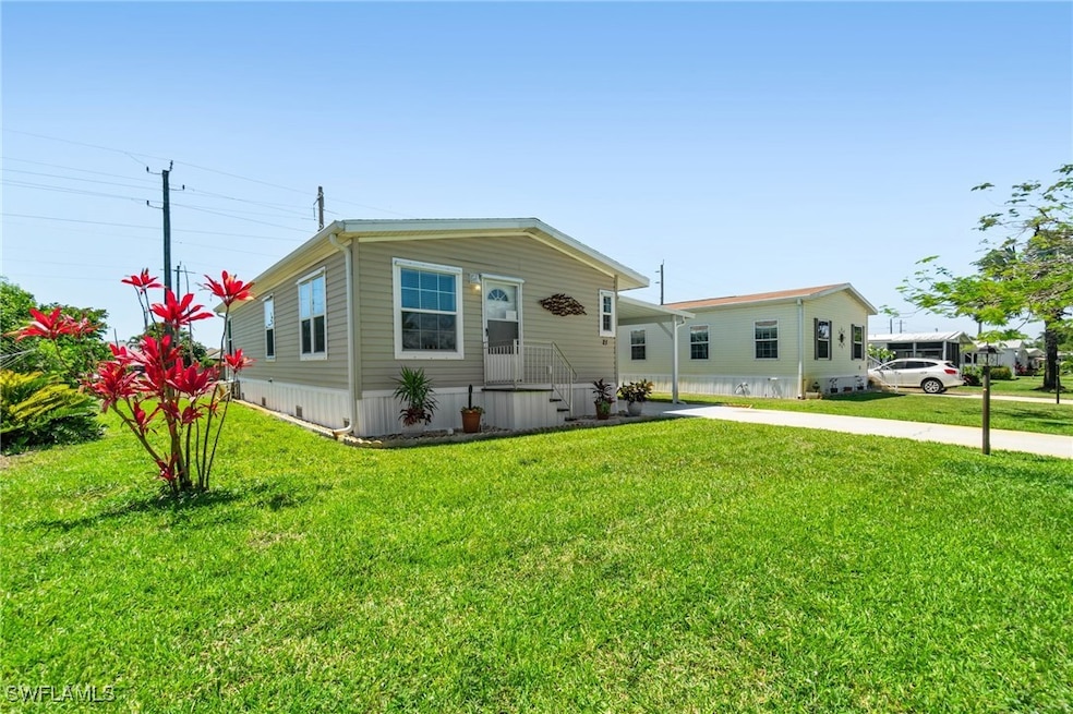 Manufactured / mobile home featuring an attached c