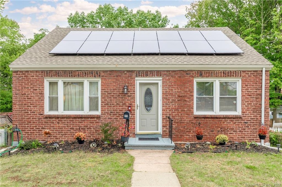 Brick Colonial with newer windows and solar panels