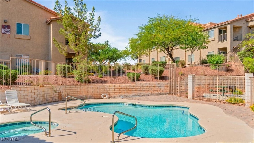 Community pool with a community hot tub and a patio area