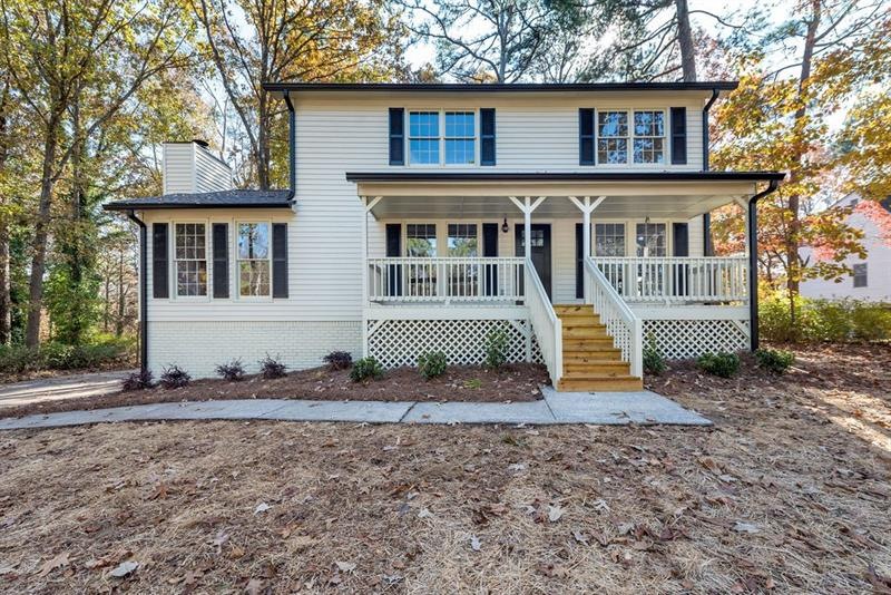 Southern charmer w/deep and wide front porch is re