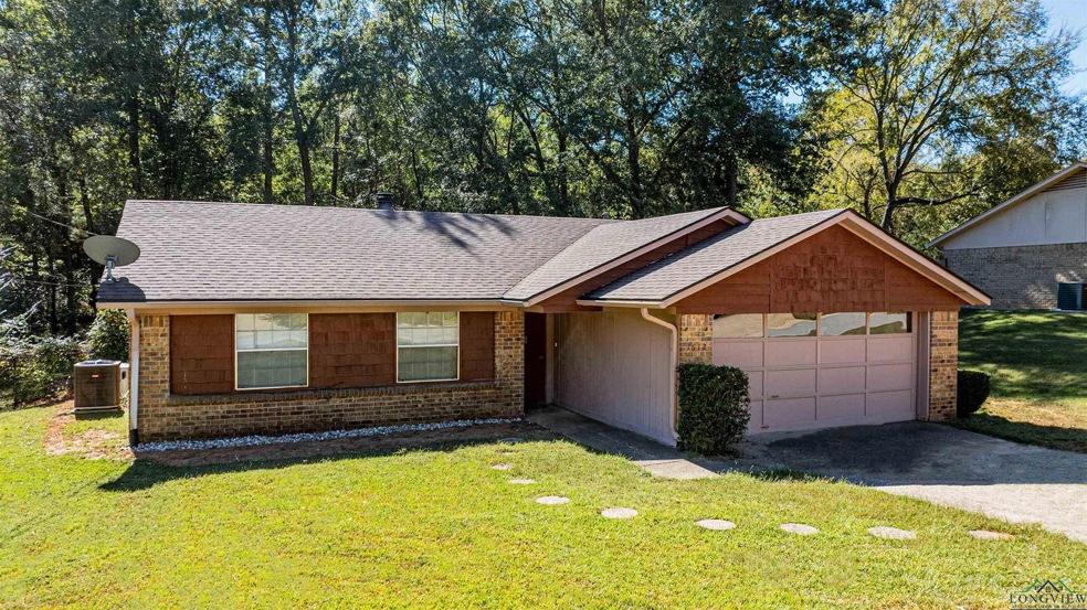 Ranch-style house featuring a front yard, central 