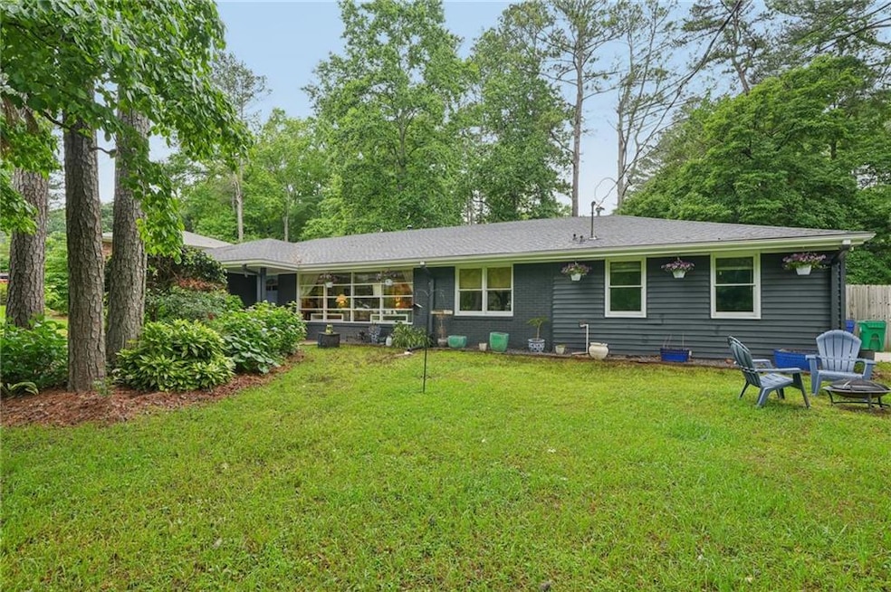 The large front yard is landscaped and welcoming