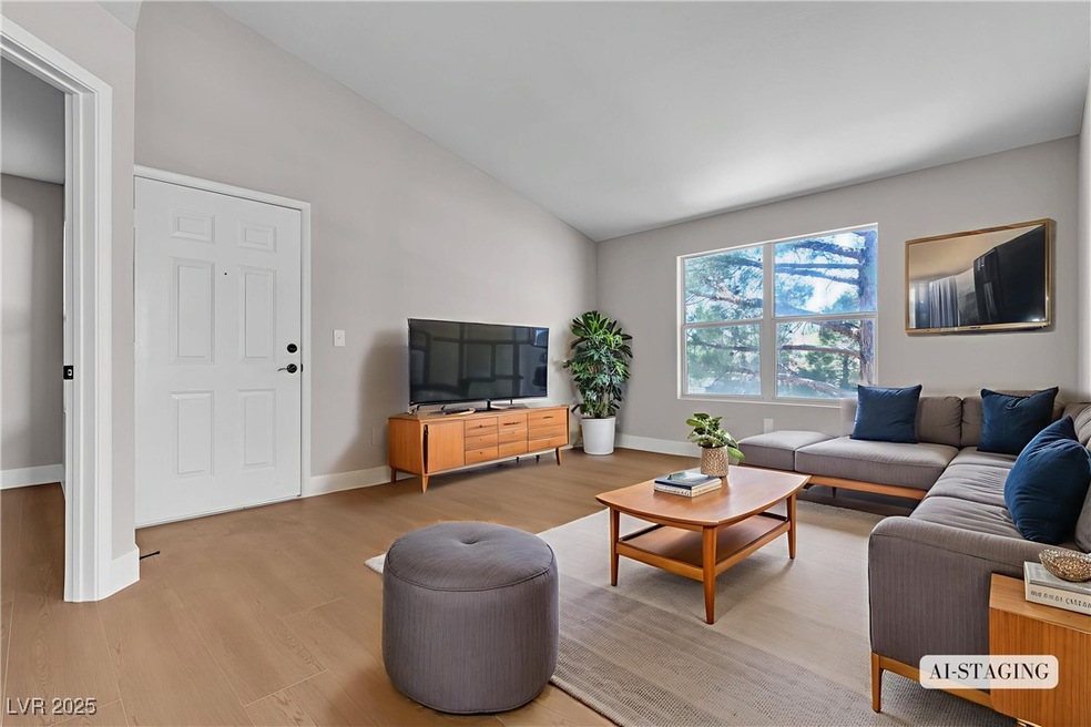 Living area with light wood finished floors and hi