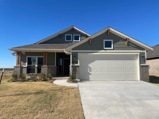 Craftsman-style home with covered porch, brick sid
