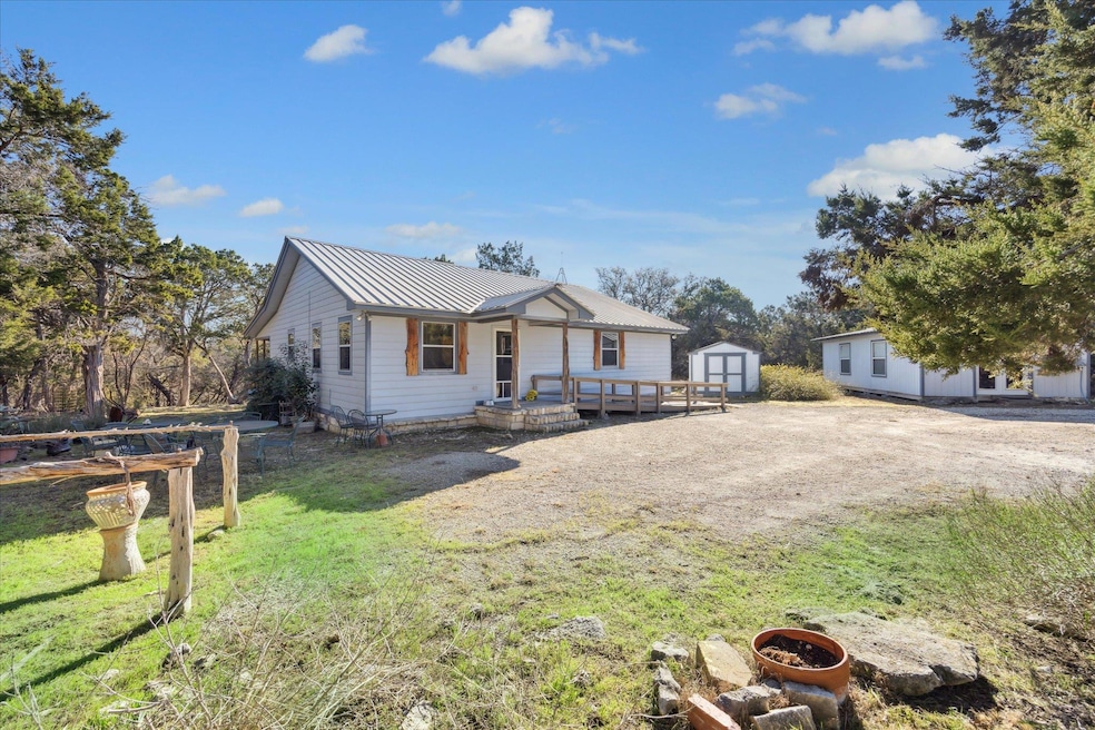 View of front of property featuring metal roof, a