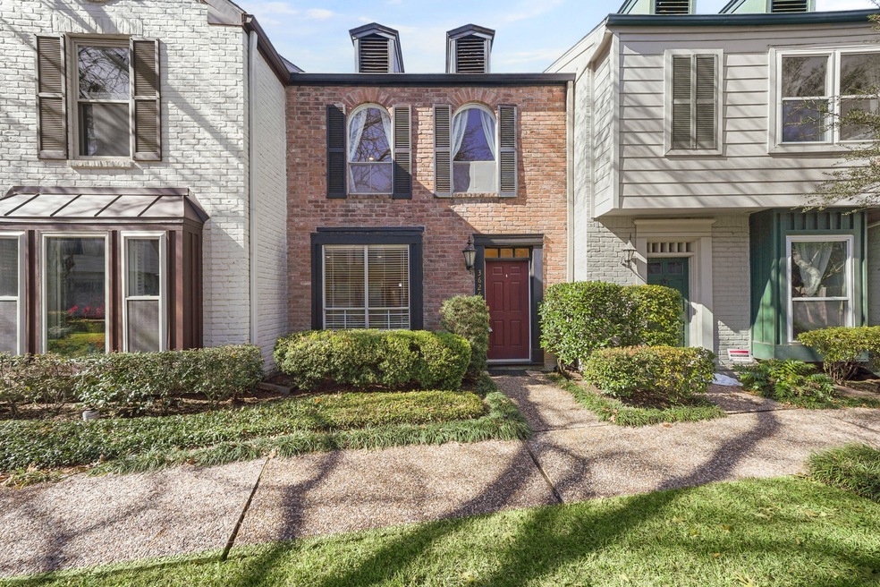 Classic red brick home with black shutters...timel