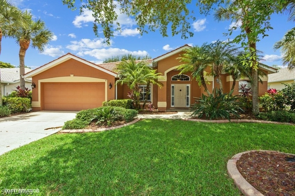 Ranch home with large 2 car garage and lush landsc
