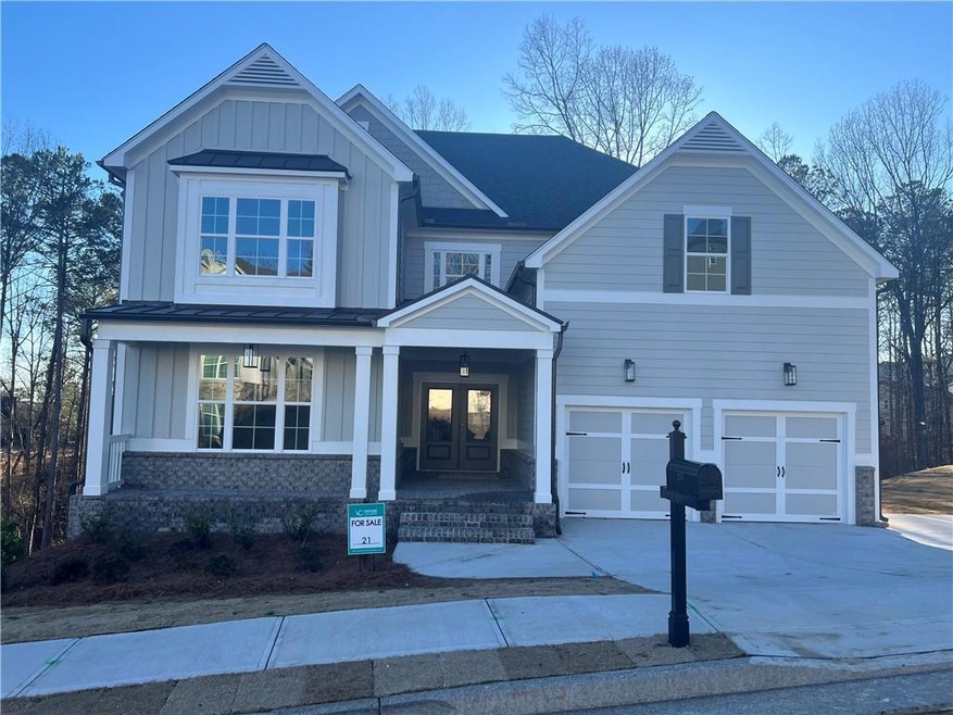 Craftsman house with a garage and a porch