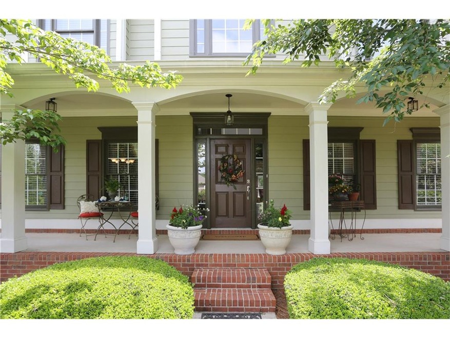 This lovely front porch greets your friends and we