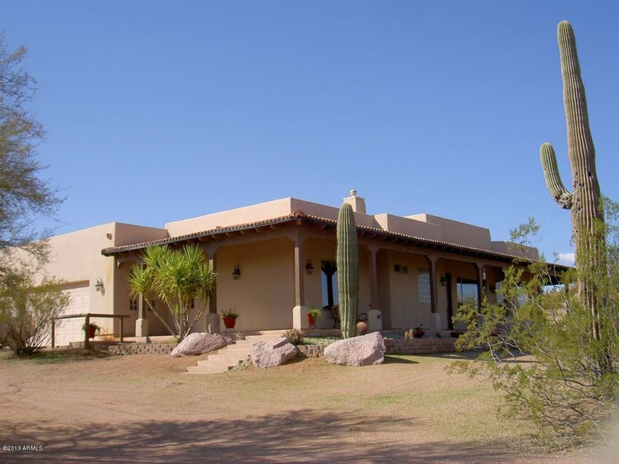 Front of Home with natural desert.