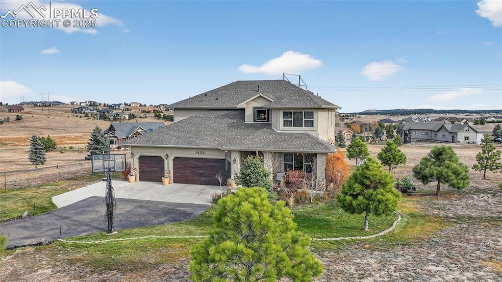 View of front of house featuring driveway, a shingled roof, stucco siding, an attached garage, and a front yard