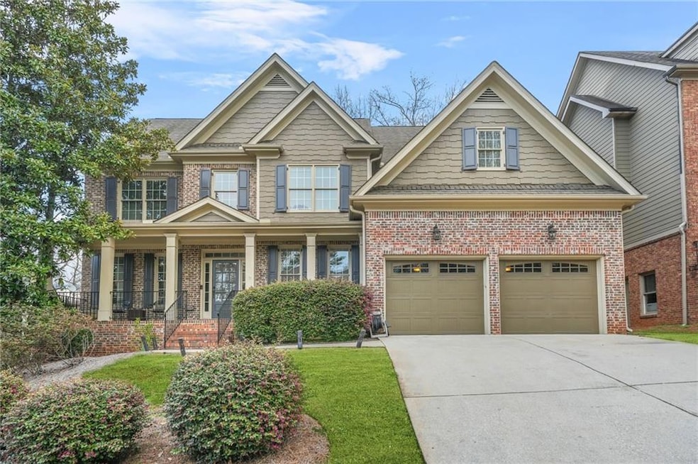 Craftsman-style house featuring brick siding and d