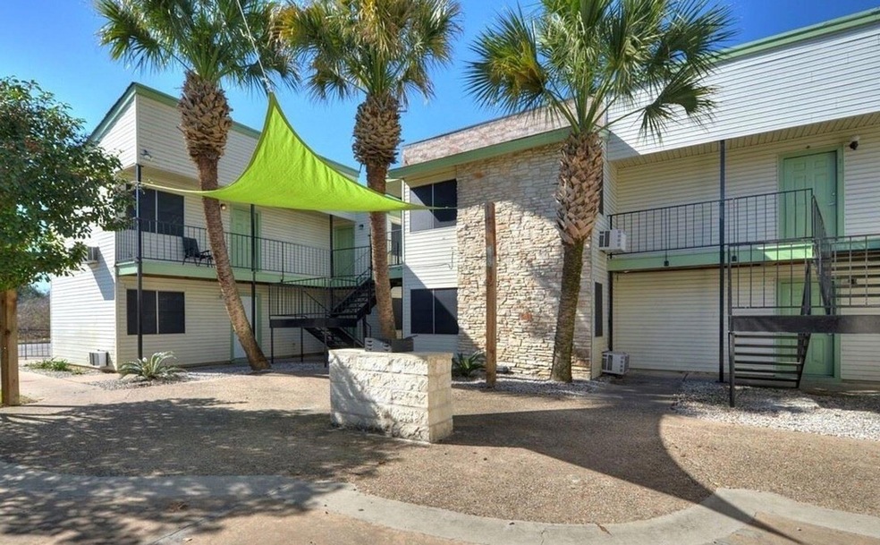 View of property with stairs and central air cond