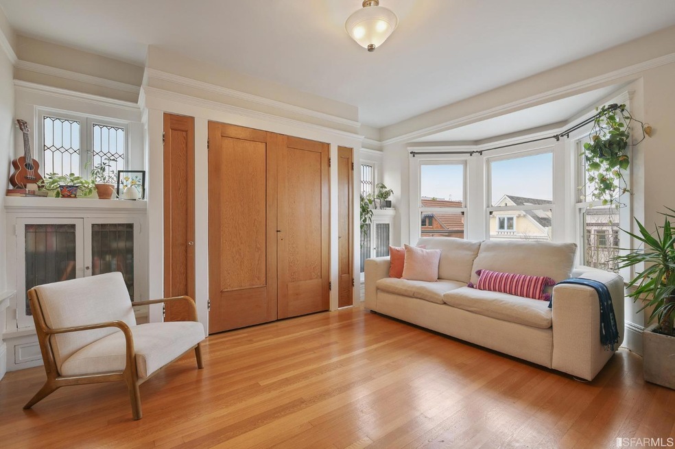 Bay windows and a Murphy Bed behind the wooden doo