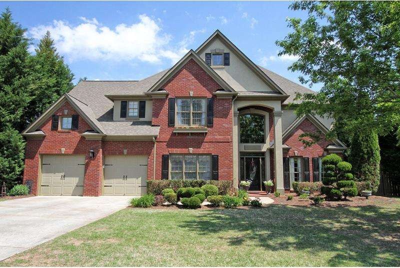 Brick home with stunning curb appeal