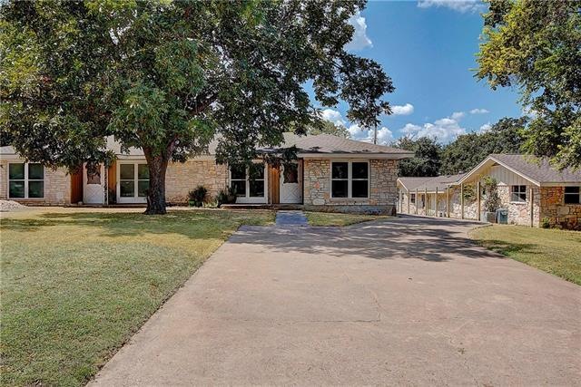 Set far back from the quiet street, this duplex is