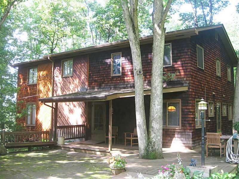 Exterior Front. Contemporary Cedar Home on 4.4 wooded acres.