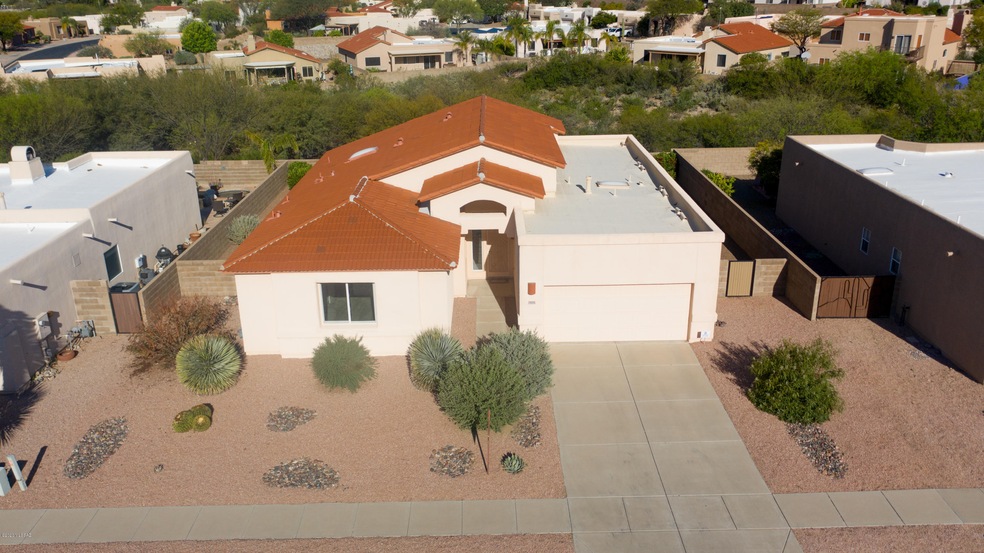 View of home and common area behind it