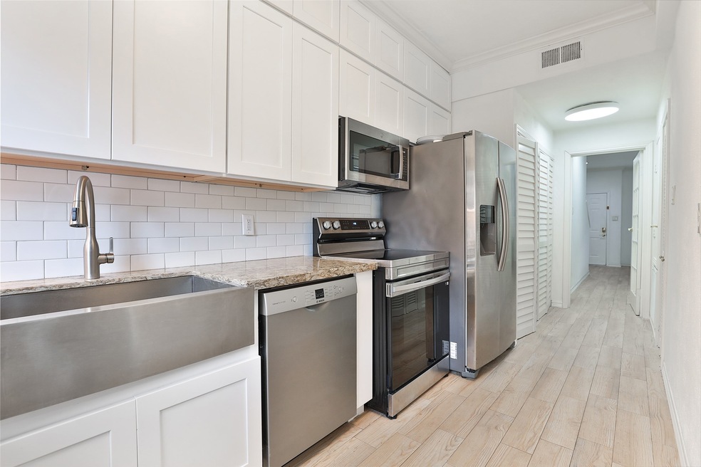 This kitchen features modern stainless steel appli