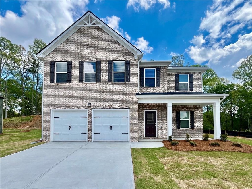 View of front of property featuring covered porch,