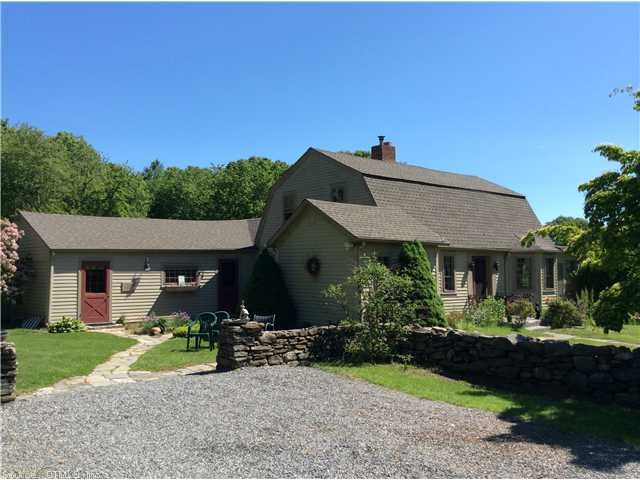 Exterior Front. Antique Gambrel Home surrounded by