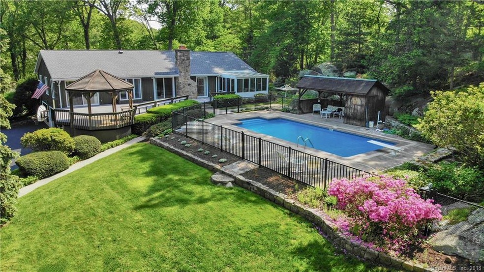 Open Floor Plan Looks out to Deck, Pool and Water 