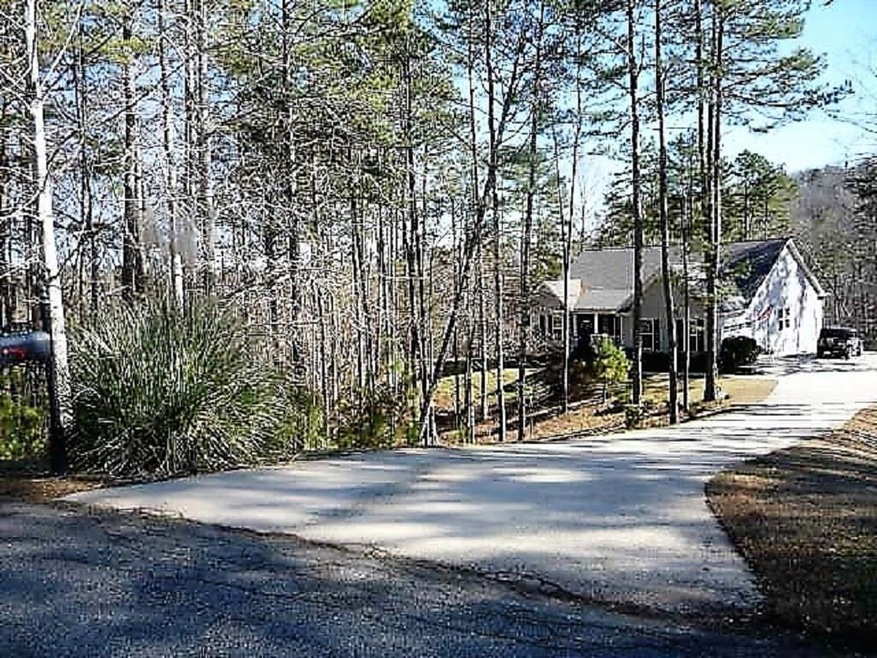 House sits off the road in a private cul de sac.