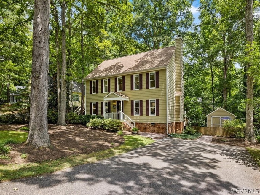 Front of home showing the paved driveway