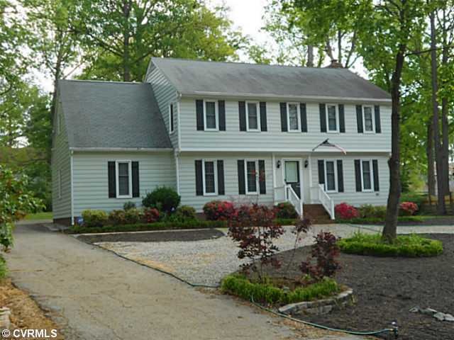 Exterior Front - Paved drive to parking in rear, c
