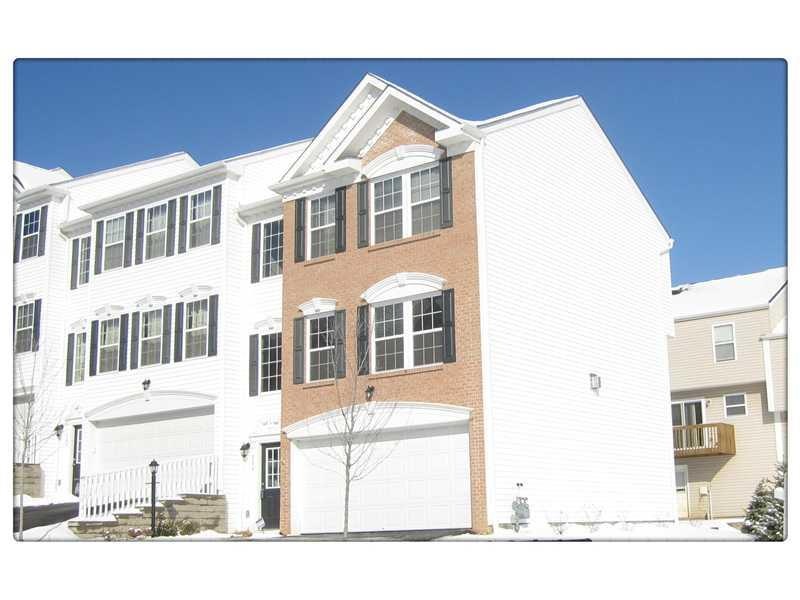 Exterior Front. Stunning end unit townhome with br