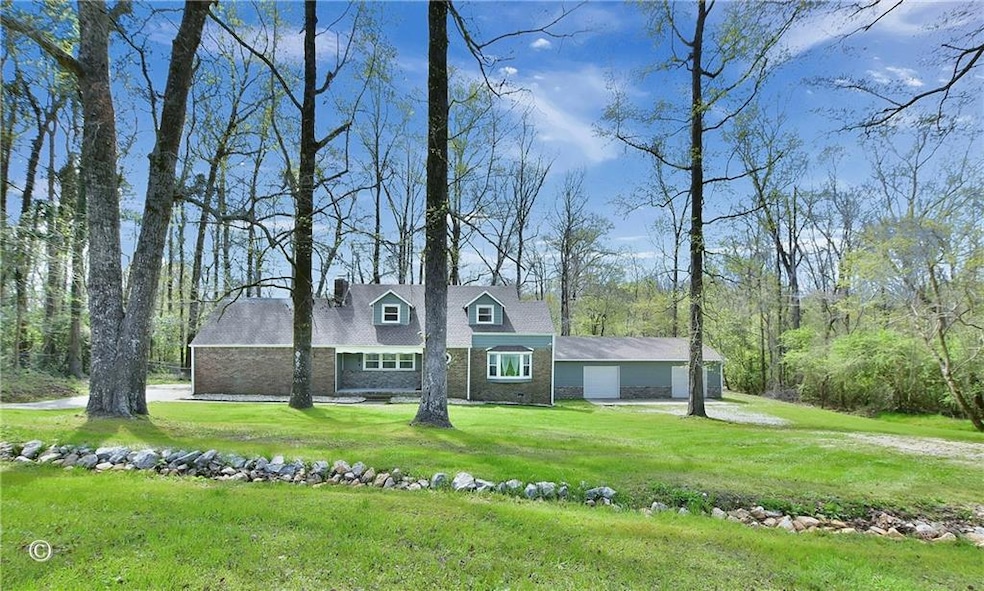 View of front facade with an attached garage, a fr